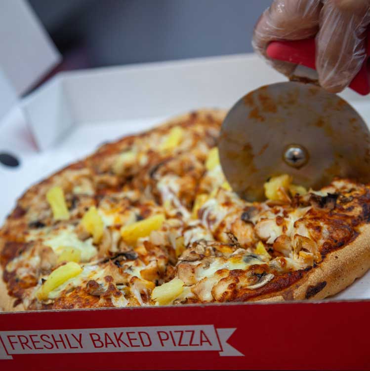 Mama Mia in Birmingham pizza topped with pineapple and chicken.